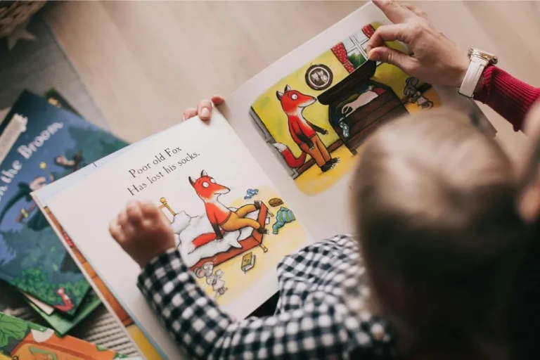 Picture of someone reading a book to a child